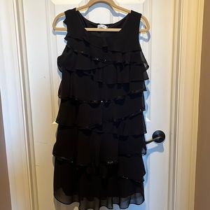 Festive black dress with plenty of ruffles